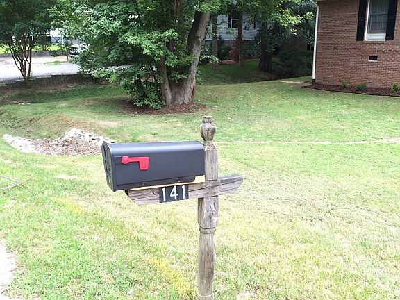 View of front yard with mature trees