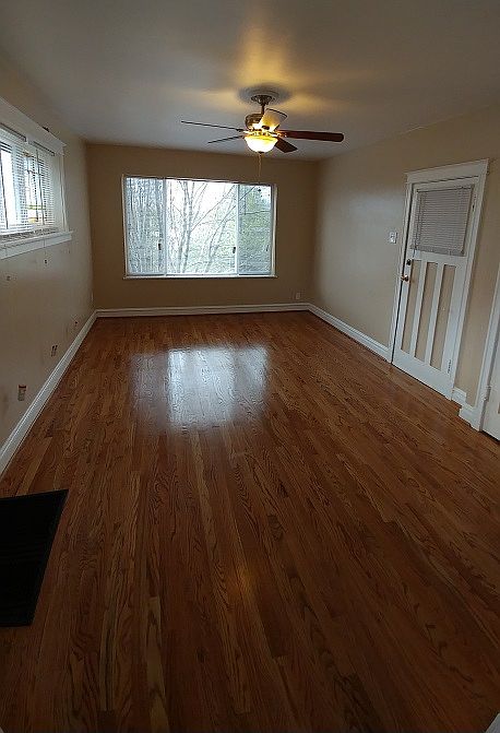 Spacious Living Room/Dining Room Gorgeous Refinished Hardwood Floors & Brand New Windows Throughout!