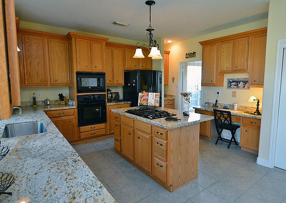 Another view of the kitchen. Tremendous space and tons of cabinet space and a HUGE pantry.