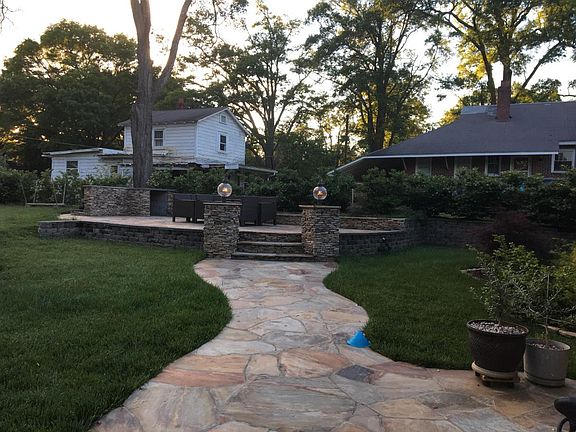 Raised patio behind house