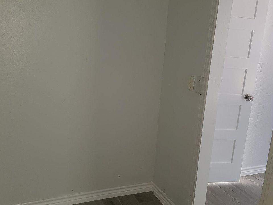 Inside of large closet looking towards bedroom