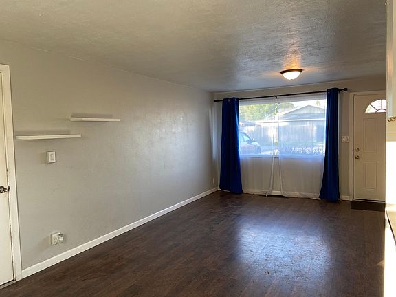 Living room facing east side of the house/street side