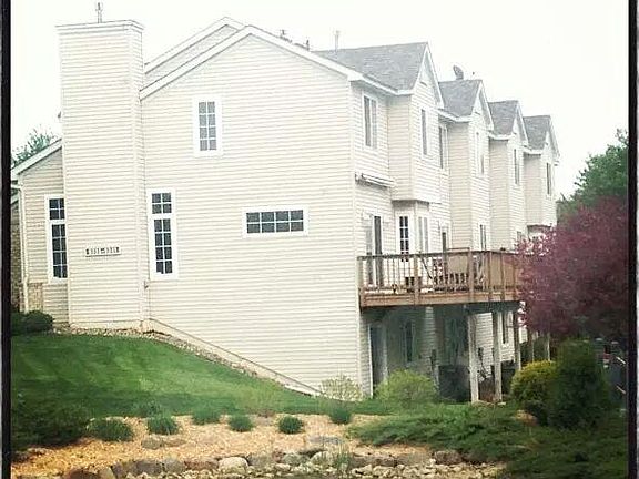 Exterior shot 3- finished walk out basement with pond view