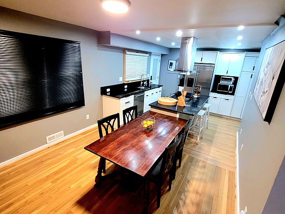 Dining room/kitchen. The dining room table can seat up to 6.