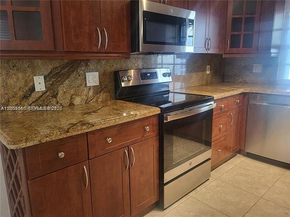1st image of 14419 SW 142nd Ct #Townhouse 14419