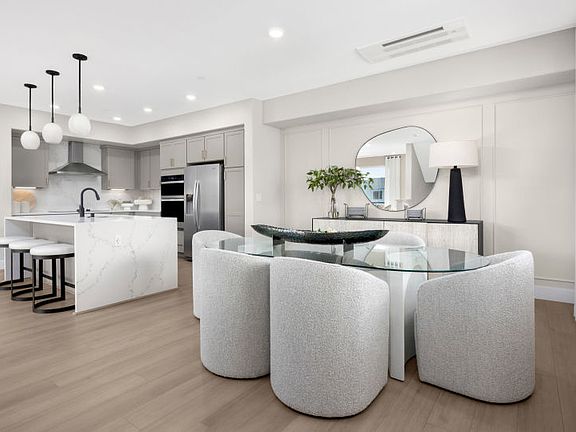 Cafe dining area open to kitchen and gathering room