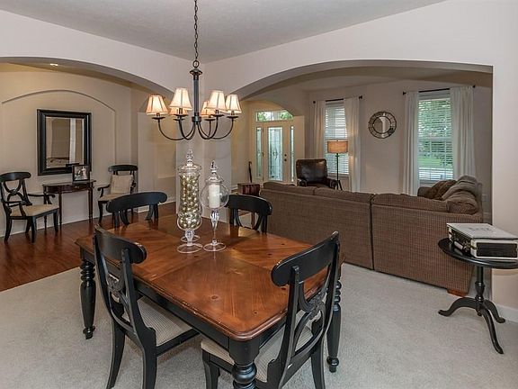 Formal dining room opens to living room area. All new carpet + fresh paint