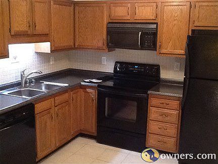 New sink & tile backsplash with tile floor. 
