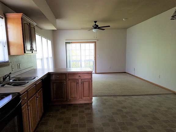 kitchen with living room and dining area
