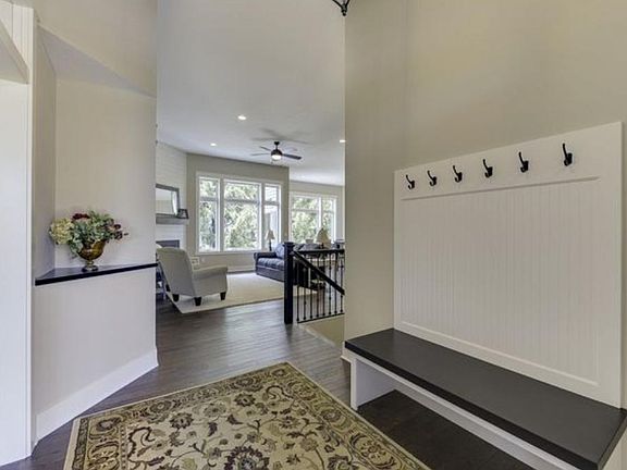 Welcoming entryway with built-in bench and hooks.