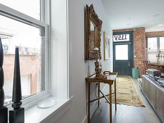 10_ tall ceilings on first floor with 3 large windows on the side