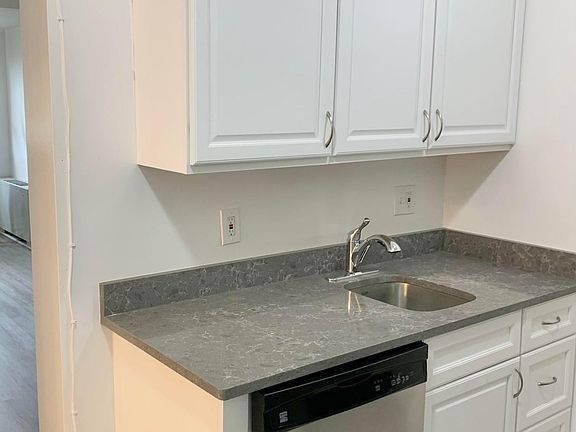 NEW STAINLESS STEEL DISHWASHER AND CABINETS