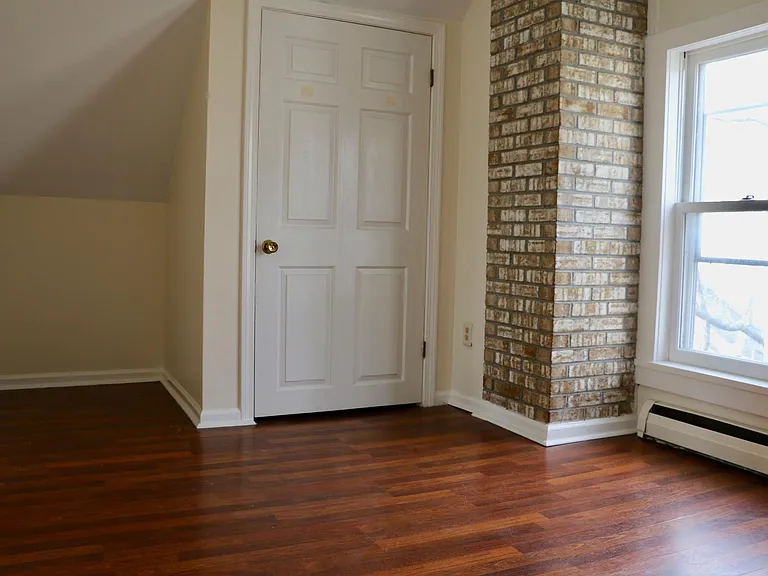 Bedroom 2 closet and rustic brick detailing.