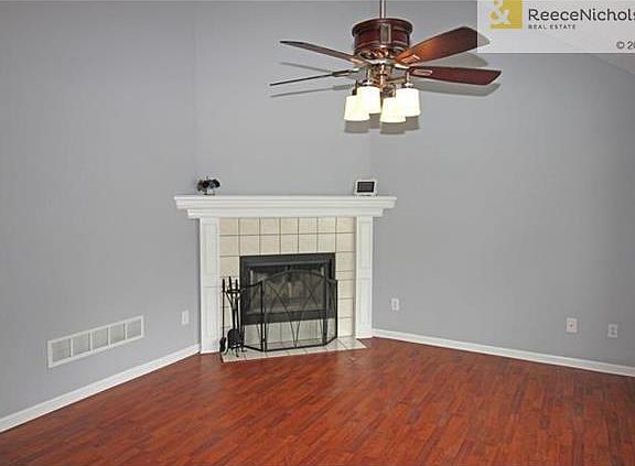 Designer Ceiling Fan and Wood Floors in Living Room