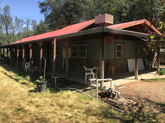 Large covered porch surrounds the home.