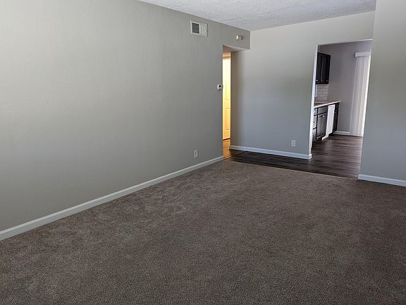 View from the front door into the main living space, kitchen and hallway