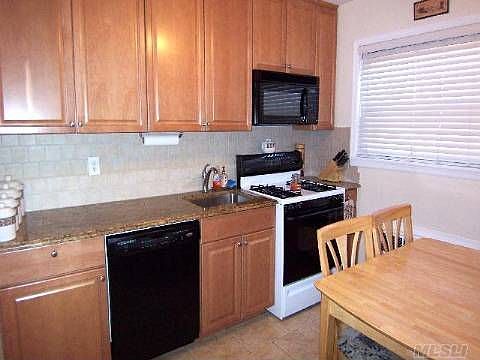 Eat in Kitchen w/ custom cabinets & granite counters