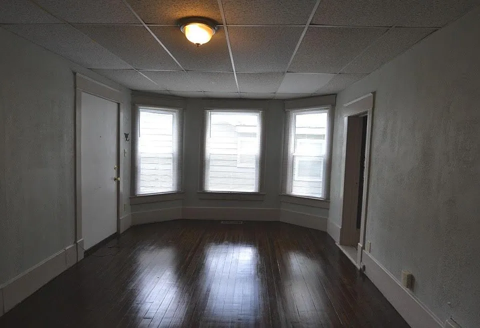 First floor living room 1. Newly refinished wood floors!