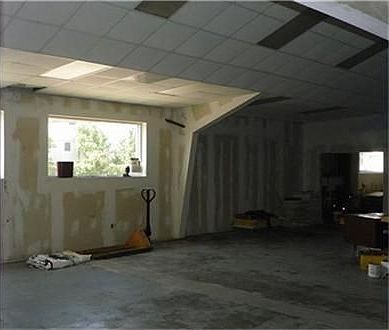 Downstairs, is a 9000 sq. ft. warehouse/office space.  About 1/2 of the warehouse space has been shelled in.  This makes it much easier to create offices, a restaurant/bar setting, or any other business need you may have