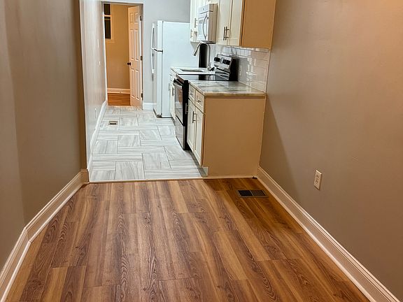 living connecting to dining room with open kitchen layout