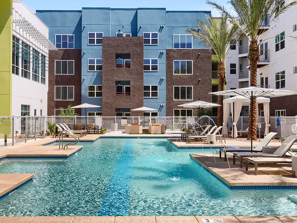 The pool deck you've been dreaming about. With lounge chairs, umbrellas, a fire pit, and sparkling water features, the Garrett Uptown courtyard is your go-to retreat to beat the Arizona heat..