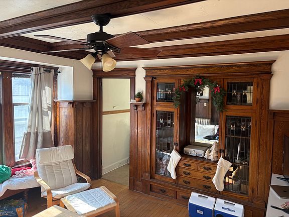 Alternate view of living room with built-in cabinets