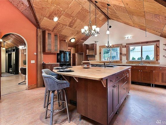 Kitchen with large island and butcher block countertops 