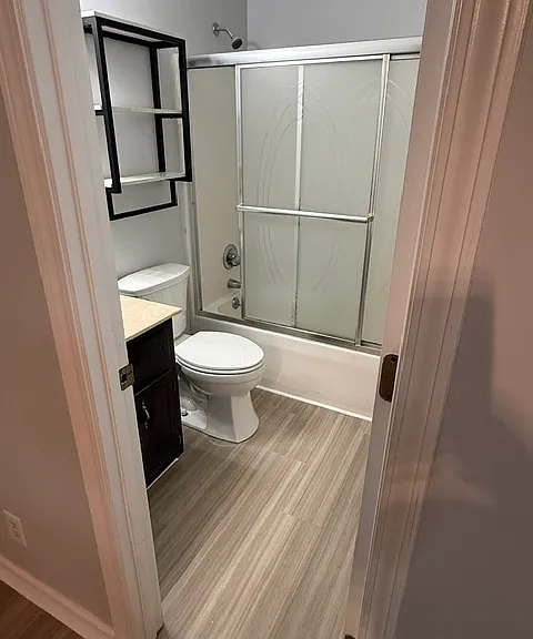 Front middle bathroom with new toilet and sink faucet