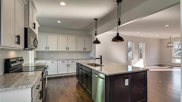 Modern open concept living, dining, kitchen area