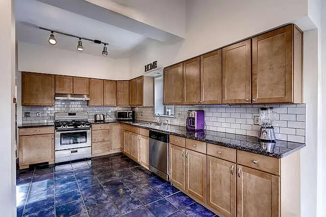 Granite counters, stainless steel appliances throughout.