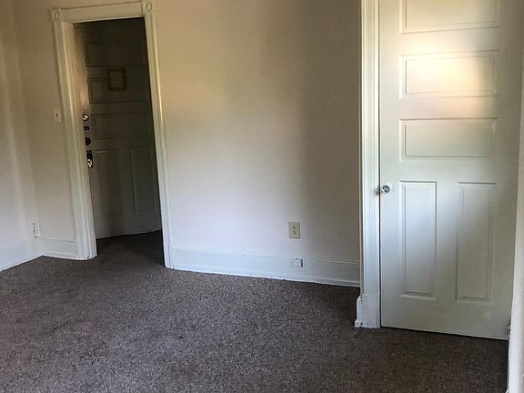 Large living room with closet, high ceilings, and great natural light.