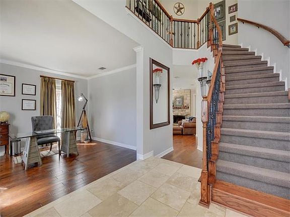 Travertine tile, wood floors, fresh paint and carpet all welcome you to this lovely remodeled home.