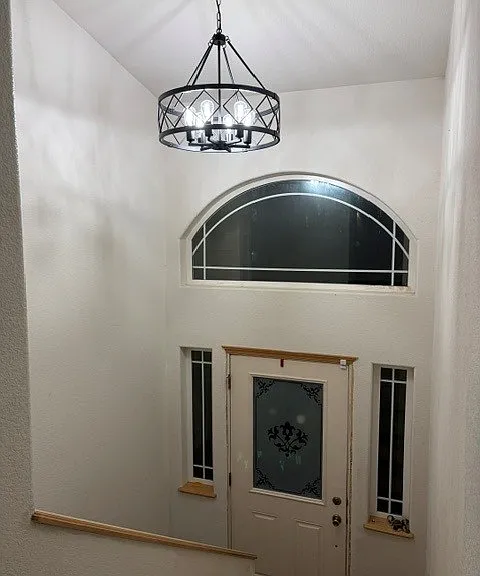 Foyer w new lighting. Trim is is now white.