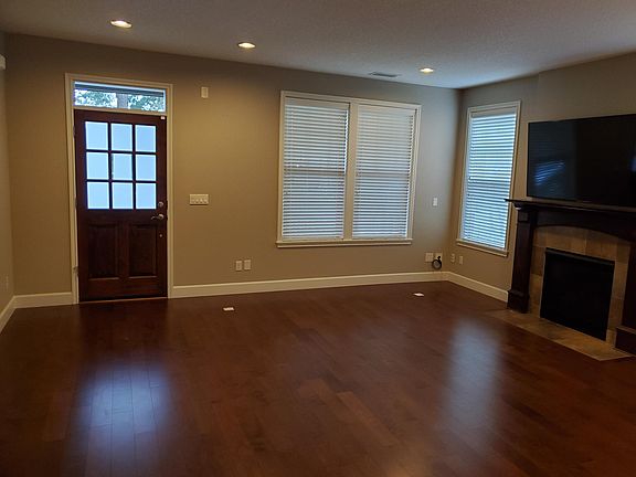 Living room with fireplace and builtin T.V.