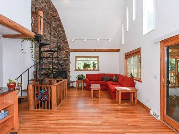 living area with stone fireplace