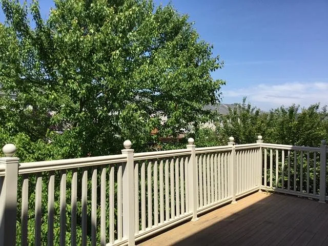 Thermal Industries Maintenance Free Custom Deck in the back overseeing large backyard.
