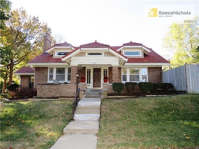 All Brick home w/ tile roof and front porch...such a BEAUTY!