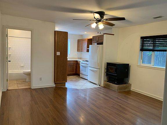 Living room, kitchen, and downstairs bathroom