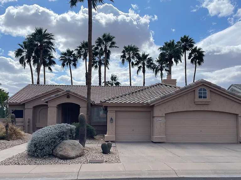Easy care Desert Front Yard Landscaping and 3 car garage on cul-de-sac street