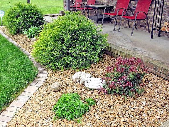 New landscaping adorns the front of the property