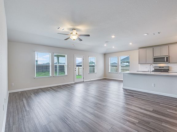 The Henderson features a modern open-concept plan in the living and dining areas.