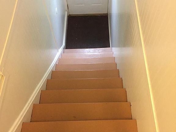 Entry door and stair leading up to the this second floor apa