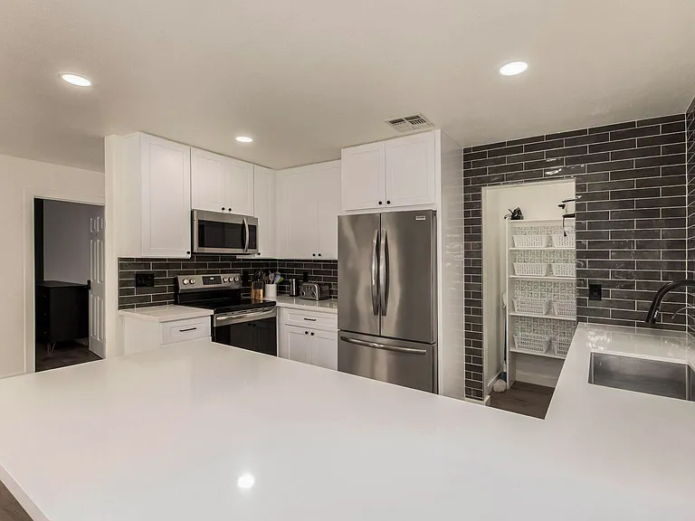 Fully loaded kitchen. Coffee pot, pots and pans, dishes, silverware, crockpot, mixer