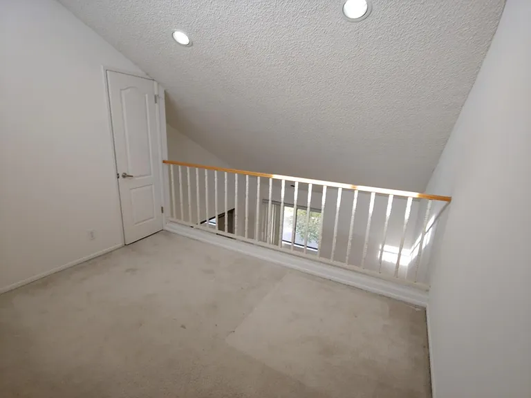 Loft area with dedicated closet overlooking Master Bedroom
