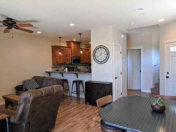 Living/dining with view of breakfast bar at the kitchen coun