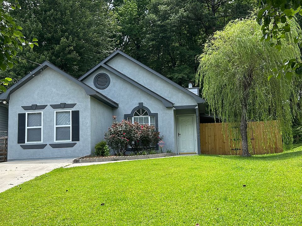 Welcome to this beautifully maintained single-story home nestled on a quiet, tree-lined street. The home features a freshly painted exterior, striking architectural details, and a lush green front lawn that creates a warm and inviting