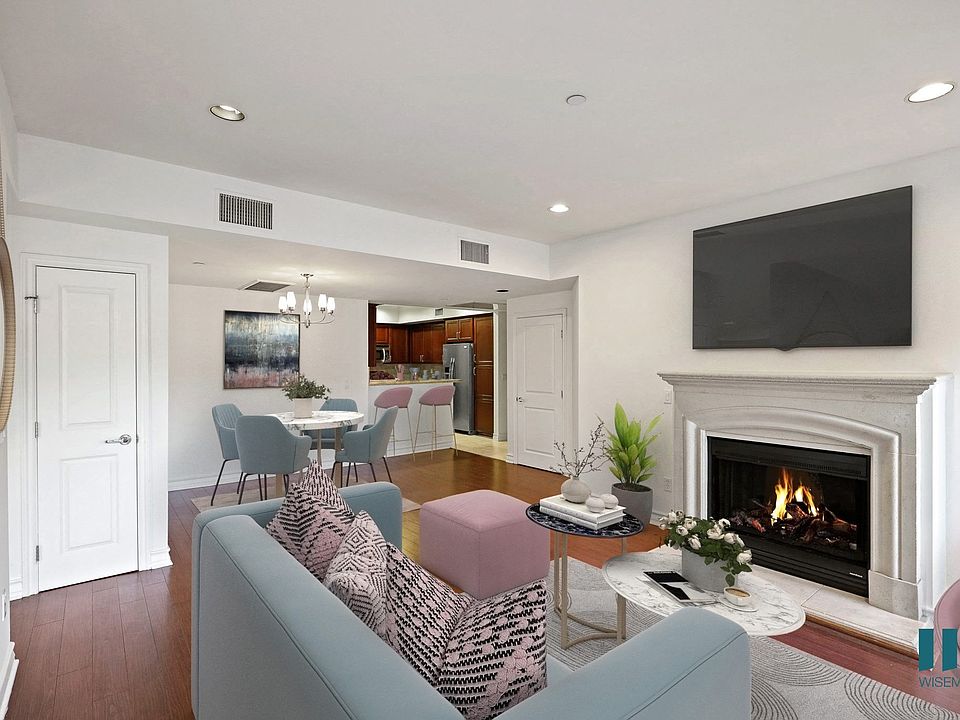 Open-Concept Kitchen, Dining, and Living Room with Hall Closet