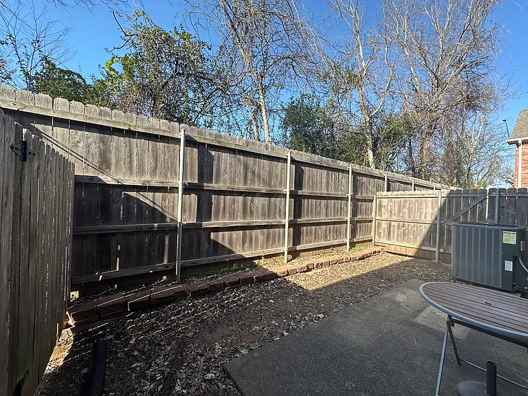 Private backyard with 8' tall fence. No other units at the back, lined with beautiful trees. New AC