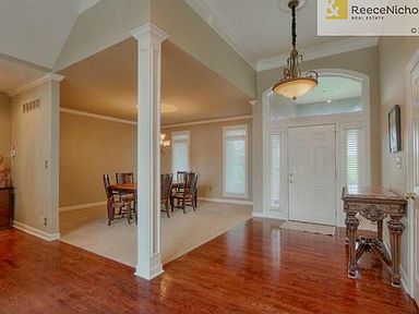 Welcoming entry with vaulted ceiling, light and bright dining ro
