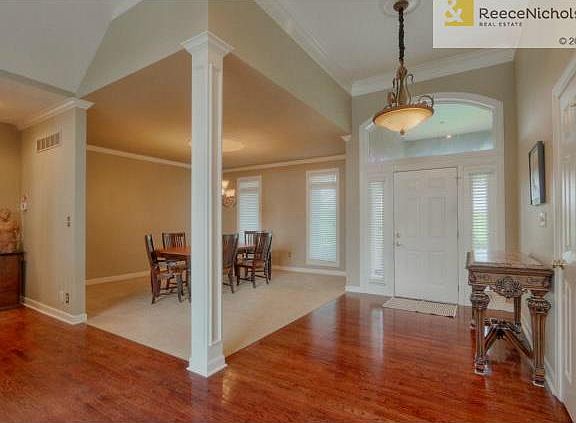 Welcoming entry with vaulted ceiling, light and bright dining ro